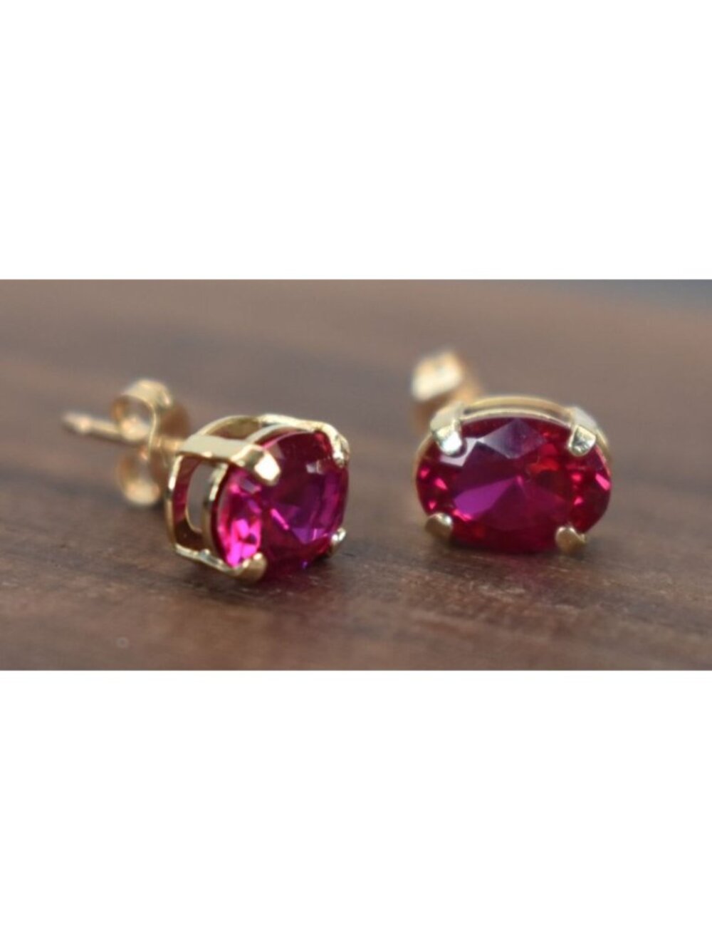 Oval Red Ruby Moissanite Stud Earrings in 10k Yellow Gold Setting
